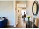 Inviting entryway with hardwood floors and neutral walls, leading to the dining area at 2268 Redfern Rd, Dacula, GA 30019