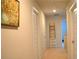 Upstairs hallway with carpeted floors, white trim, and multiple doors for bedroom access at 2268 Redfern Rd, Dacula, GA 30019