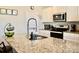 Bright kitchen featuring granite countertops, stainless steel appliances, and ample counter space at 2268 Redfern Rd, Dacula, GA 30019