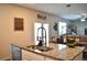 Granite countertop island looking to dining and living area in open concept floorplan at 2268 Redfern Rd, Dacula, GA 30019