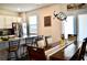 Bright kitchen with white cabinets, granite countertops, stainless steel appliances, and a breakfast bar at 2268 Redfern Rd, Dacula, GA 30019