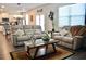 Inviting living room featuring neutral walls, modern furniture, and an open floor plan at 2268 Redfern Rd, Dacula, GA 30019