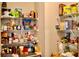 Walk-in pantry with metal shelves, filled with assorted groceries and supplies at 2268 Redfern Rd, Dacula, GA 30019