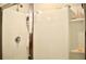 Shower stall with handheld shower head, built-in shelving for toiletries, and sliding glass doors at 2268 Redfern Rd, Dacula, GA 30019