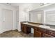 Bathroom featuring double sinks with a large mirror at 3158 Arbor Oaks Way, Snellville, GA 30039