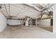 Unfinished basement with concrete floor, exposed ducts, cinder block walls, and wooden stairs leading to the main floor at 3540 Honeycomb Se Dr, Conyers, GA 30094