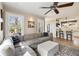 Open concept living room with a comfortable sectional couch, hardwood floors and an airy feel at 750 Clemont Ne Dr, Atlanta, GA 30306