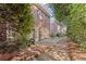 Inviting backyard with a brick patio and lush landscaping, offering a private outdoor space at 1245 Village Terrace Ct, Dunwoody, GA 30338
