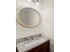 Elegant bathroom featuring granite countertop and decorative mirror at 1245 Village Terrace Ct, Dunwoody, GA 30338