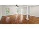This bedroom includes hardwood floors, lots of natural light, and a tray ceiling at 1245 Village Terrace Ct, Dunwoody, GA 30338