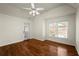 Bright bedroom with a ceiling fan, hardwood floors, and natural light at 1245 Village Terrace Ct, Dunwoody, GA 30338