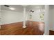 Bedroom features a tray ceiling, hardwood floors, columns, and natural light at 1245 Village Terrace Ct, Dunwoody, GA 30338