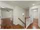 Upstairs hallway with hardwood flooring and views to adjacent rooms at 1245 Village Terrace Ct, Dunwoody, GA 30338