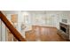 Inviting living room with hardwood floors, stone fireplace, and bright windows at 1245 Village Terrace Ct, Dunwoody, GA 30338