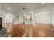 Spacious living area with hardwood floors, staircase, and seamless access to the kitchen at 1245 Village Terrace Ct, Dunwoody, GA 30338