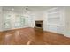 Bright living room with hardwood floors, built-in shelves, and a cozy fireplace at 1245 Village Terrace Ct, Dunwoody, GA 30338