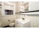Classic bathroom featuring black and white tile, window, and a white vanity at 1709 Rogers Sw Ave, Atlanta, GA 30310