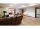 Finished basement featuring neutral carpet, leather sofas, and an adjacent game room perfect for relaxing at 1755 Presidents Dr, Lawrenceville, GA 30043