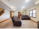 Spacious finished basement featuring neutral carpet, recessed lighting, and leather sofas for comfortable seating at 1755 Presidents Dr, Lawrenceville, GA 30043