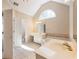Bright bathroom featuring double sink vanity, garden tub, and elegant fixtures at 1755 Presidents Dr, Lawrenceville, GA 30043