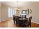 Formal dining room featuring hardwood floors, traditional decor, and natural light at 1755 Presidents Dr, Lawrenceville, GA 30043