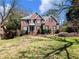 Charming two-story brick home with manicured landscaping and a well-maintained lawn at 1755 Presidents Dr, Lawrenceville, GA 30043