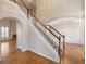 Grand foyer with hardwood floors and staircase leads to living and dining areas at 1755 Presidents Dr, Lawrenceville, GA 30043