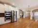 Open concept kitchen features stainless appliances, hardwood floors and view to entry foyer at 1755 Presidents Dr, Lawrenceville, GA 30043