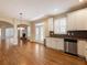 Open concept room showing living room with fireplace and adjacent kitchen at 1755 Presidents Dr, Lawrenceville, GA 30043