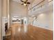 Bright open living room with fireplace, view of the kitchen, and gleaming hardwood floors at 1755 Presidents Dr, Lawrenceville, GA 30043