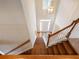 Open foyer staircase with hardwood steps and natural light from above at 1755 Presidents Dr, Lawrenceville, GA 30043