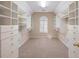 Spacious walk-in closet with custom shelving and ample storage space at 1755 Presidents Dr, Lawrenceville, GA 30043