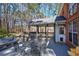 Cozy back deck and screened in porch with outdoor seating, ideal for relaxation and enjoying wooded views at 5327 Saville Nw Dr, Acworth, GA 30101