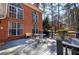 Outdoor deck area with a dining table, chairs, and a view of the surrounding landscape at 5327 Saville Nw Dr, Acworth, GA 30101