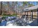 Inviting back deck featuring outdoor seating and a scenic view of the surrounding woods at 5327 Saville Nw Dr, Acworth, GA 30101