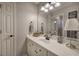 Bright bathroom featuring a single sink vanity and updated light fixture at 5327 Saville Nw Dr, Acworth, GA 30101