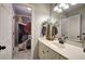 Clean bathroom featuring a shower/tub with a stylish curtain and white vanity at 5327 Saville Nw Dr, Acworth, GA 30101