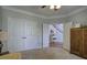 Spacious carpeted bedroom with an open doorway and ample closet space at 5327 Saville Nw Dr, Acworth, GA 30101