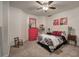 Cozy bedroom featuring a queen-sized bed, painted furniture, and decorative wall art at 5327 Saville Nw Dr, Acworth, GA 30101