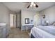 Bedroom with a ceiling fan, carpet, and a window with decorative curtains providing lots of light at 5327 Saville Nw Dr, Acworth, GA 30101