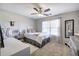Bedroom with a ceiling fan, carpet, and a window with decorative curtains providing ample light at 5327 Saville Nw Dr, Acworth, GA 30101