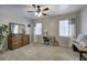 Spacious bedroom with ample natural light, dresser, desk, and neutral carpeting at 5327 Saville Nw Dr, Acworth, GA 30101