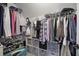 Walk-in closet with ample shelving and hanging space for clothes and accessories at 5327 Saville Nw Dr, Acworth, GA 30101