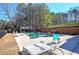 Community pool with plenty of lounge seating and covered area for relaxation at 5327 Saville Nw Dr, Acworth, GA 30101