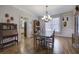 Hardwood floors, a chandelier, and adjacent rooms in a stylish dining area at 5327 Saville Nw Dr, Acworth, GA 30101