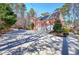 Elegant brick home with a three-car garage, expansive driveway and mature trees at 5327 Saville Nw Dr, Acworth, GA 30101