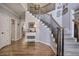 Welcoming foyer with a staircase, hardwood floors, and tasteful decor, creating a warm and inviting entrance at 5327 Saville Nw Dr, Acworth, GA 30101