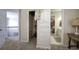 Hallway with walk-in closet, built-in armoire, and bathroom access at 5327 Saville Nw Dr, Acworth, GA 30101