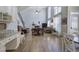 Open kitchen flowing into living area with high ceilings, great natural light and hardwood flooring at 5327 Saville Nw Dr, Acworth, GA 30101