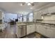 Bright, open kitchen featuring granite countertops, stainless steel appliances, and hardwood floors at 5327 Saville Nw Dr, Acworth, GA 30101